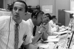 photograph of white men in NASA Mission Control from 1969